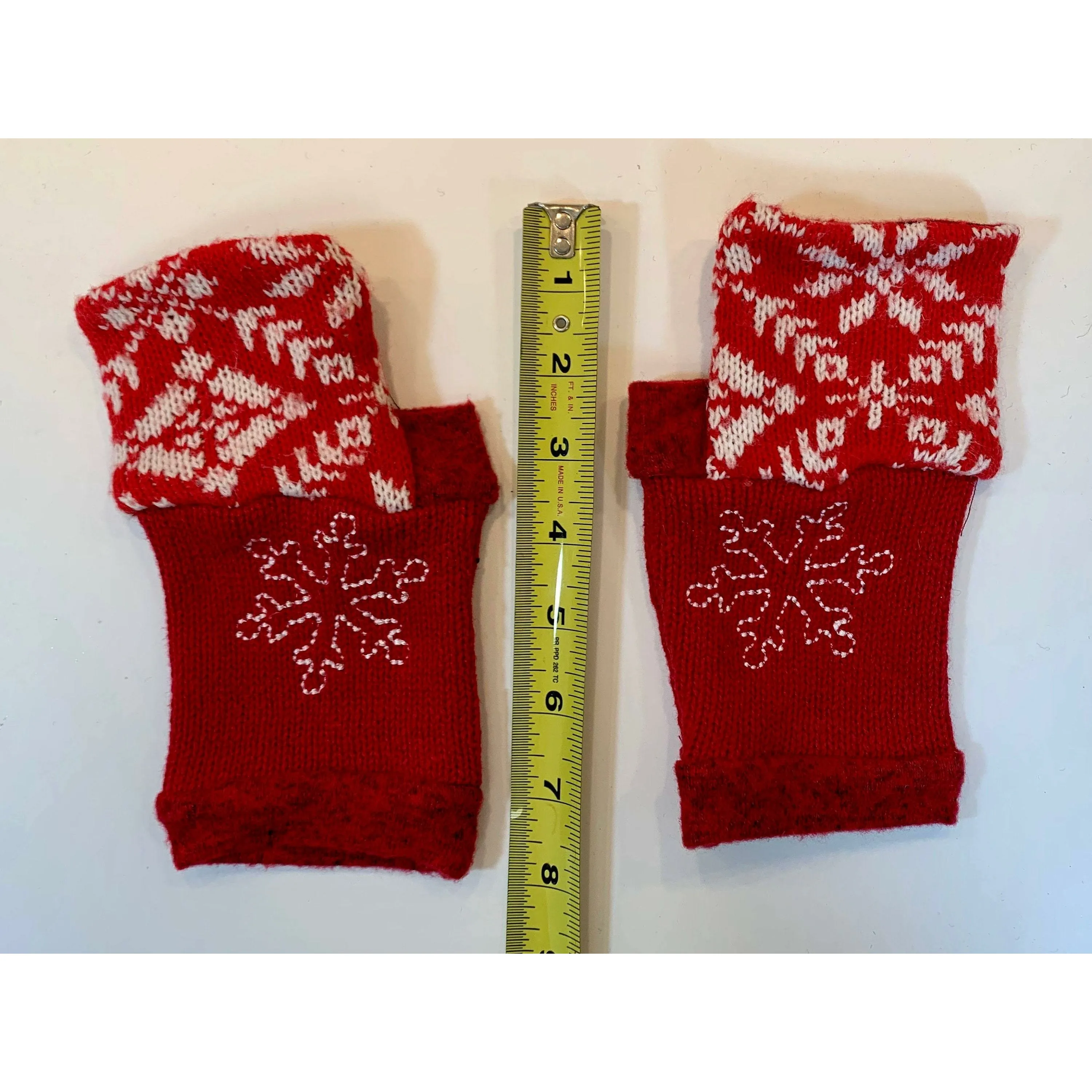 Recycled Scandinavian pattern sweater fingerless gloves in reds with embroidered snowflake. Wear for fun, school, cashiers, fingers free.