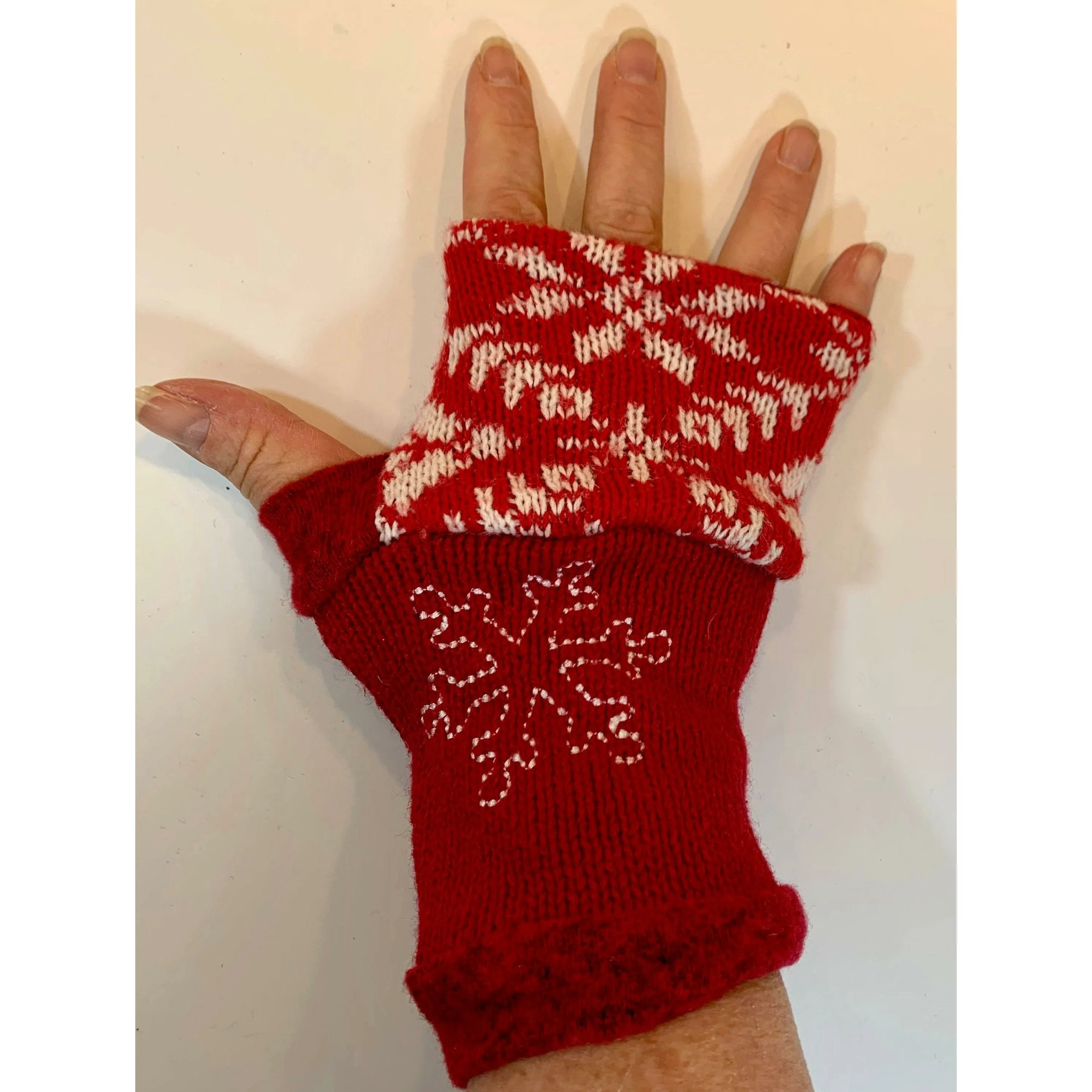 Recycled Scandinavian pattern sweater fingerless gloves in reds with embroidered snowflake. Wear for fun, school, cashiers, fingers free.