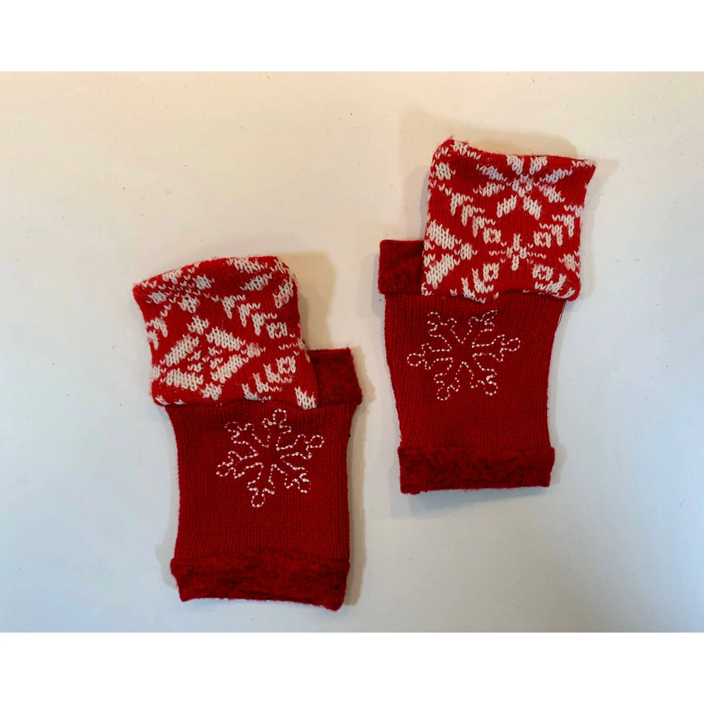 Recycled Scandinavian pattern sweater fingerless gloves in reds with embroidered snowflake. Wear for fun, school, cashiers, fingers free.